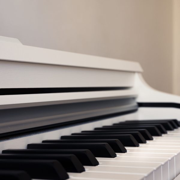 Elegance upright piano. Classic piano keyboard with black and white keys. Musical image close up